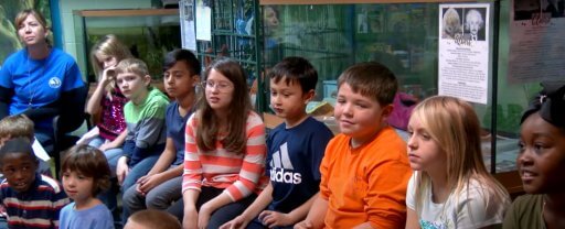 Children watching a demonstration at the Emerald Coast Science Center