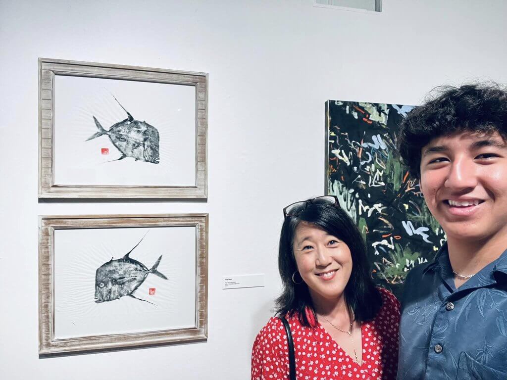 Judy Otero and son at the Pensacola Museum of Art, where work by Saltwater Impressions is on display for a special exhibit.