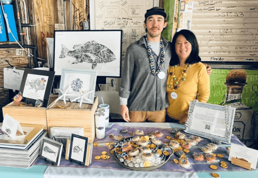 Judy Otero and son at a pop-up table for Saltwater Impressions