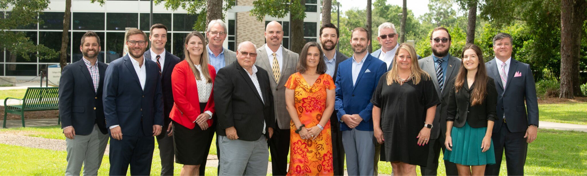 The Florida SBDC at UWF team in June 2024 in front of the university's Lewis Bear Jr. College of Business