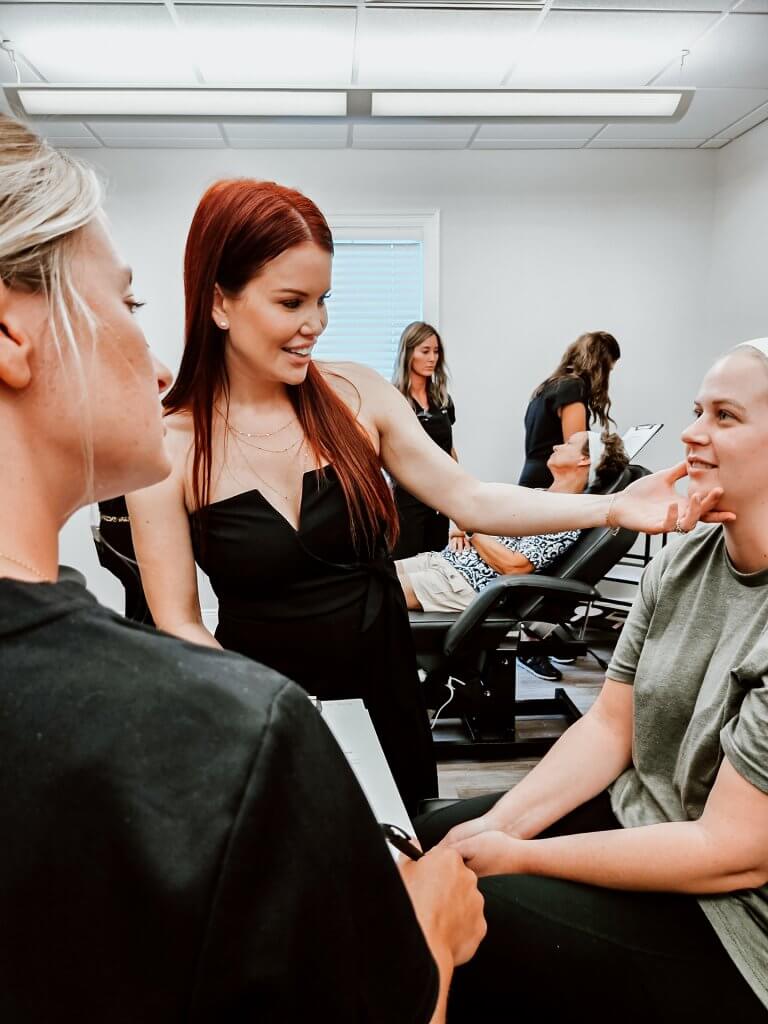 Brittany Perez, of MELA Medical Spa and Method Aesthetics Academy in Pensacola, works with a patient.