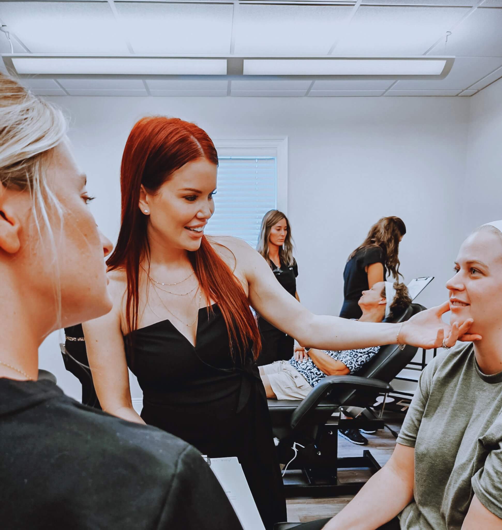 Brittany Perez, of MELA Medical Spa and Method Aesthetics Academy in Pensacola, works with a patient.