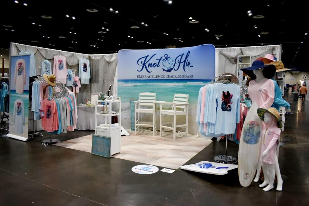 Knot His 850, founded by Jeannie Pope, sells UV-protection water shirts on display at a 2024 Surf Expo.