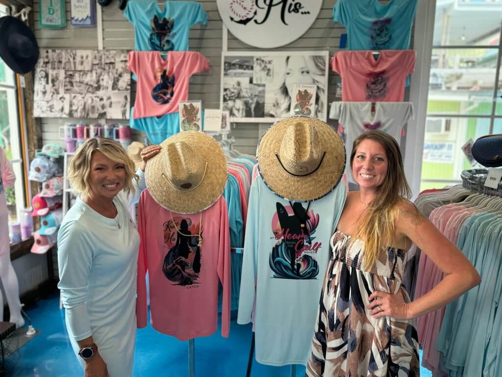 Jeannie Pope (at left), owner of Knot His 850, poses with wholesale customer Toni LaBatt, Retail Operations Manager at Harborwalk Marina, with Jeannie's UV-protection apparel on display at the marina in Destin, Florida.