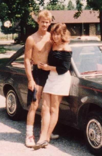 Bob Woodin and Lisa in 1988 posing for a photo in front of a car